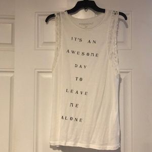 White tank top with lace around arm area